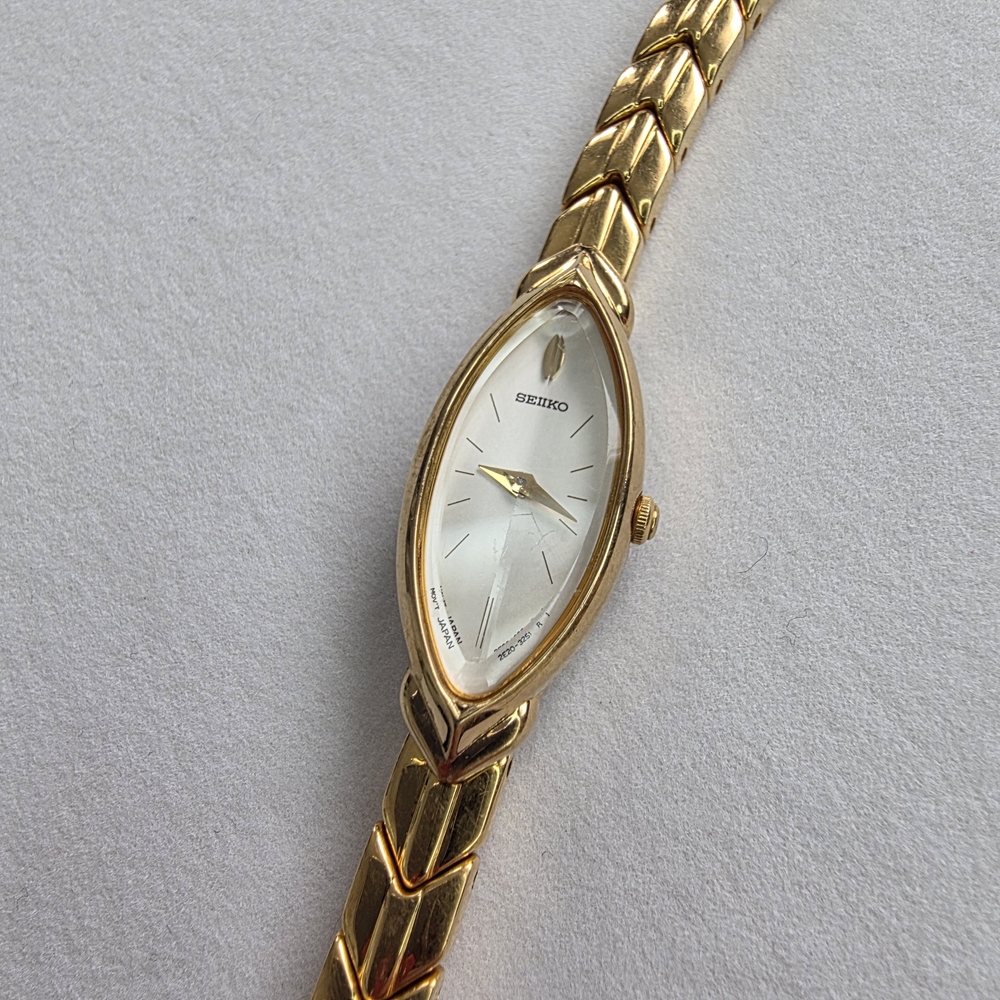 Seiko Women's Gold and White Watch